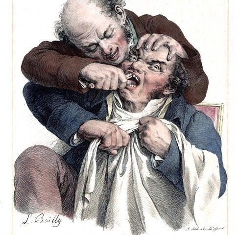 Georgian dentist extracting tooth