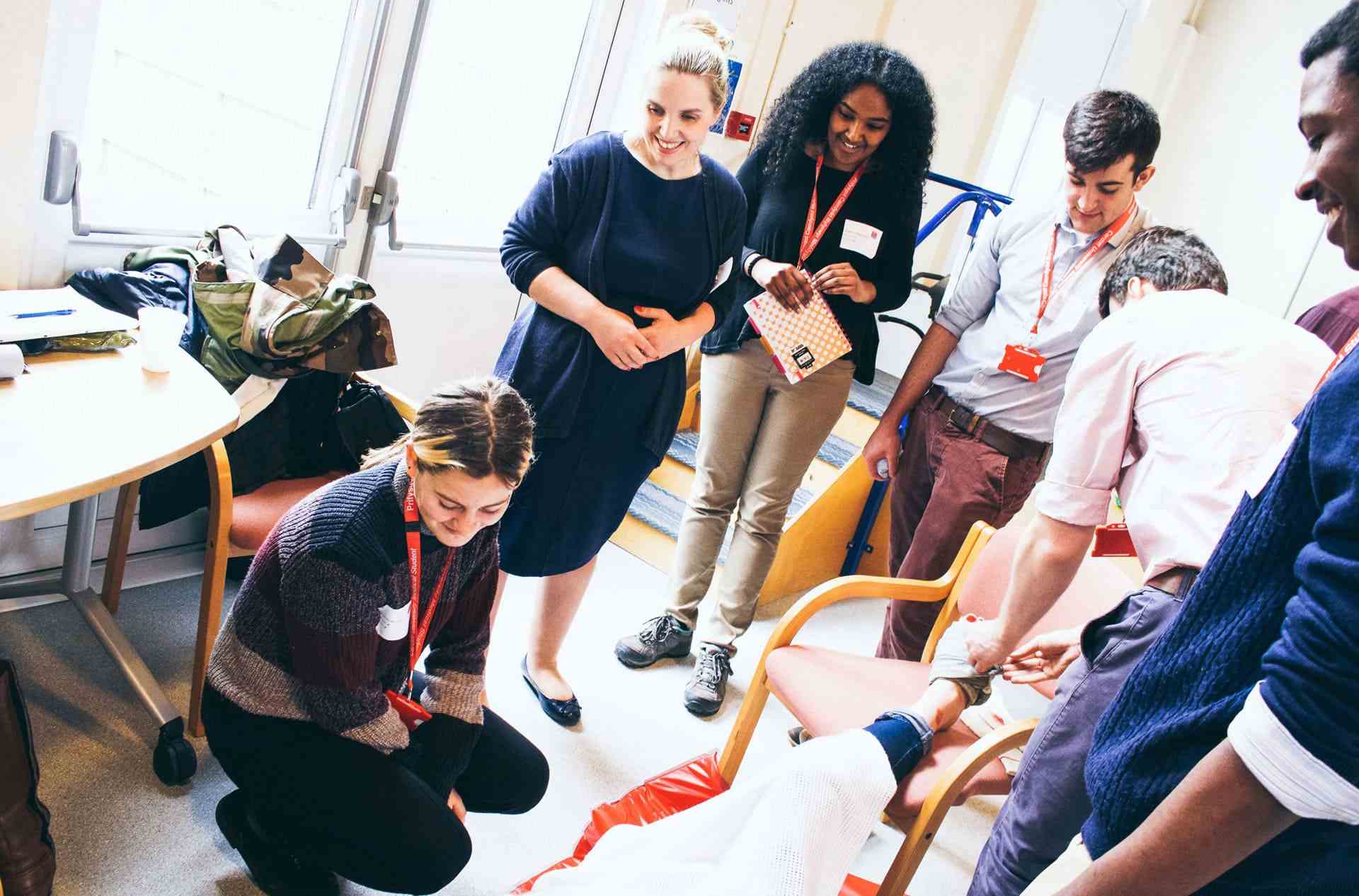 trainer teaching CPR at a dental practice,.