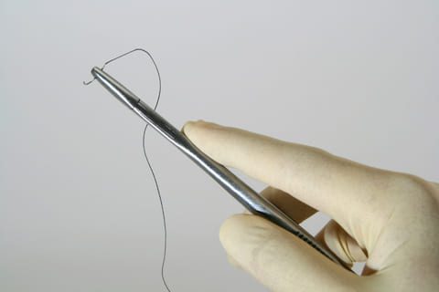Hand holding suture