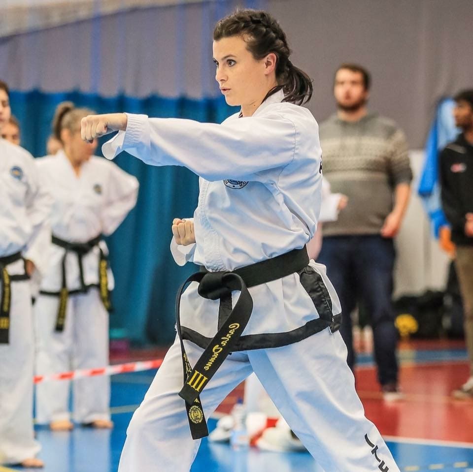 Female Martial Arts blackbelt punching